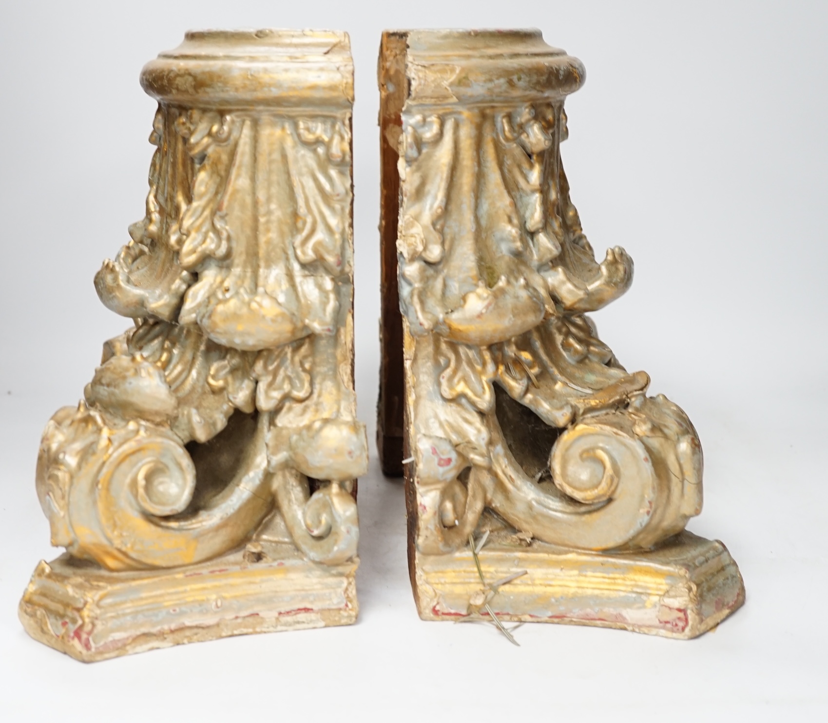 A carved wood and gesso gilt column base in two sections, 28cm high. Condition- fair